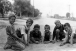 Six boys playing marbles in the middle of Scottsdale Road ca. 1920